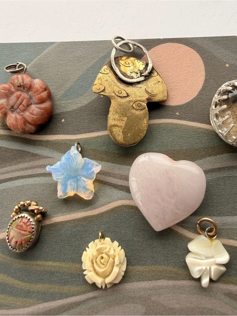 Vintage and handmade whimsical charms, pendants stones.